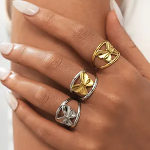 Minimalist titanium steel bow rings for women in gold, silver, and two-tone finishes