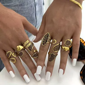 Detail of chunky gold jewelry set with leopard print inserts and irregular shapes