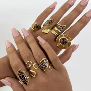 Golden leopard print rings set with geometric shield and oval shapes for women