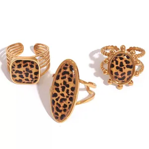 Three-piece leopard print gold ring set with geometric shapes and adjustable bands