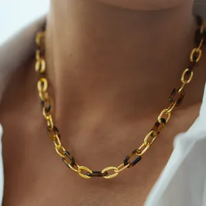 Classic leopard tortoiseshell resin and gold link necklace shown on a female model