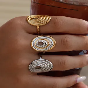 Minimalist spiral geometric titanium steel rings in gold, silver, and two-tone finishes