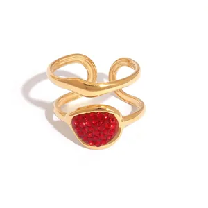 Double-layer wavy golden ring with a large pear-shaped red zircon inlay for women