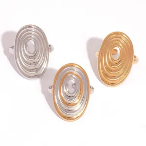 Polished stainless steel spiral textured geometric rings in silver and gold finishes