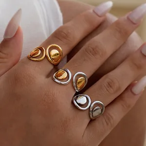 Minimalist geometric hollow open rings in gold and silver finish with polished teardrop design