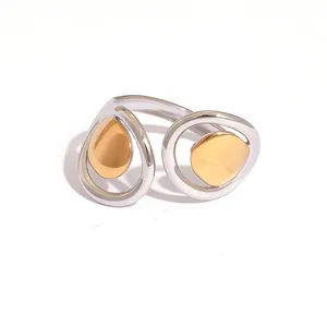 Minimalist geometric two-tone open ring with polished silver and gold hollow design