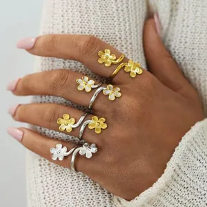 Minimalist flower wrap open ring in gold and silver finishes with textured petals
