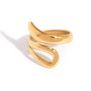 Minimalist wavy gold open ring in polished stainless steel with flowing curved design
