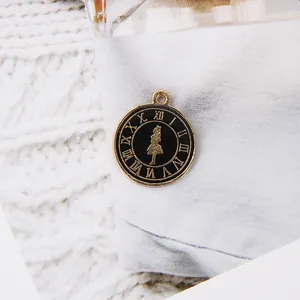 Detailed macro view of vintage clock style alloy charm with black enamel and gold numerals