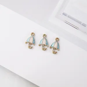 Three gold alloy umbrella pendants with blue enamel and rhinestones for DIY jewelry