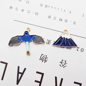 Emaille bedeltjes met blauwe vogel en Fuji-berg voor DIY sieraden maken