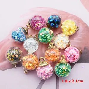 DIY colorful glass ball pendants with iridescent sequins and gold metal loops