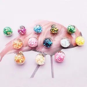 DIY jewelry making supplies featuring colorful sequins filled in glass ball pendants
