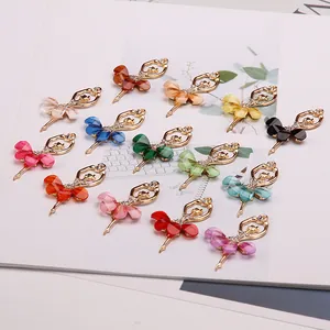Macro display of assorted ballerina crystal pendants in diverse colorful resin and rhinestones