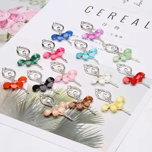 Close-up of ballet dancer alloy charms with colorful resin skirts and sparkling crystals