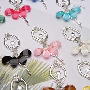 Detailed view of crystal ballet dancer charms with colorful resin wings for DIY jewelry making