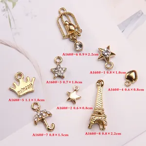 Golden alloy DIY pendants set featuring Eiffel Tower, stars and crowns with rhinestones