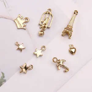 Golden alloy DIY charms set featuring crown, Eiffel Tower, heart and star for jewelry making