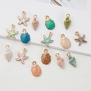 Handmade ocean charm set with colorful shell, starfish and conch enamel pendants