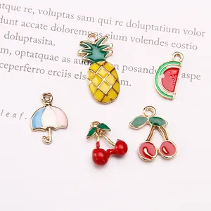 Detailed macro view of colorful enamel fruit charms including cherry and pineapple