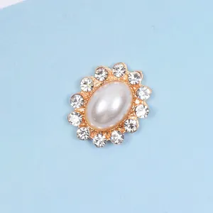 Macro detail of oval pearl alloy button with sparkling rhinestone border for DIY jewelry