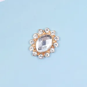 Macro shot of oval crystal button with gold alloy base for DIY hair accessory making