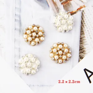 Flat lay of star flower pearl buttons with rhinestones and alloy bases for DIY crafts