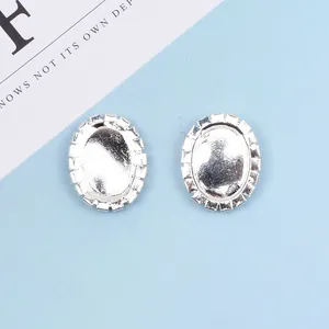 Pair of oval silver metal DIY hair accessory bases with decorative claw chain edges