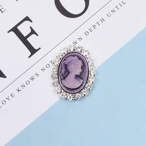 Close-up of vintage purple oval relief cameo with shimmering rhinestones for DIY hair accessories