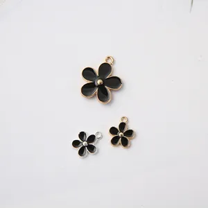 Pendentifs marguerites en émail noir et métal pour la création de bijoux DIY