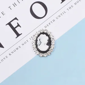 Detail of vintage cameo pendant with rhinestone edges for DIY hair accessories