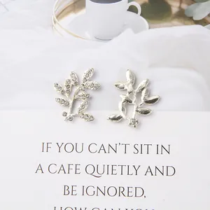 Pair of sparkling leaf-shaped silver alloy accessories with embedded rhinestones for DIY crafts