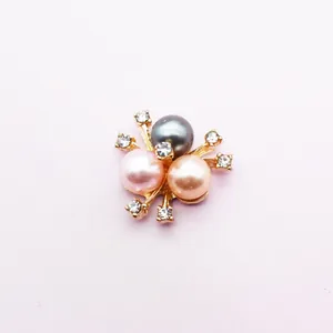Close-up of three-color pearls and rhinestones on gold alloy DIY flower accessory
