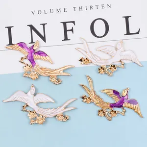 Four-piece set of swallow bird alloy hair accessories with floral base in purple and white