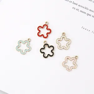 Detailed view of colorful enamel hollow flower pendants with gold alloy frames in five colors
