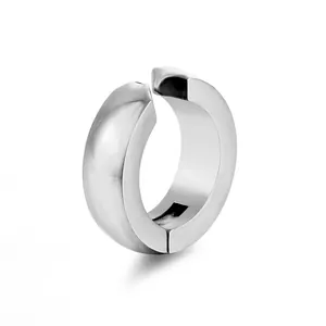 Close-up of polished stainless steel ear cuff with smooth mirror-like surface and open design