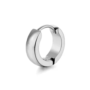 Close-up of polished silver stainless steel huggie earring with secure snap closure