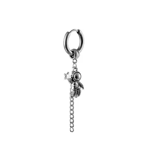 Silver astronaut drop earring with star pendant and long metal chain tassel