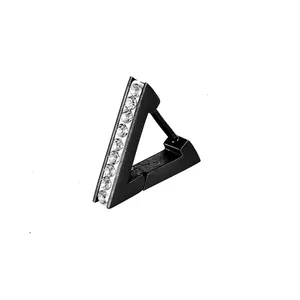 Macro shot of triangle black titanium ear cuff with inlaid clear crystals detail