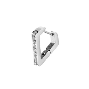 Close-up of silver triangular huggie earring with vertical pavé-set zircons on white backdrop