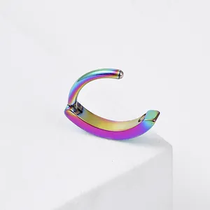 Macro view of rainbow titanium navel ring with hinged segment hoop for body piercing