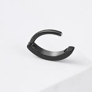 Detailed macro view of black polished stainless steel hinged segment belly ring jewelry