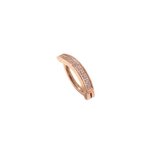 Rose gold curved belly button ring featuring clear round cubic zirconia stones