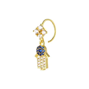 Golden Hamsa Hand nose ring with blue and white zircons and a floral top design