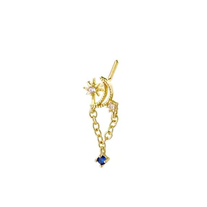 L-shaped gold nose stud with star, crescent moon, and blue gemstone pendant detail