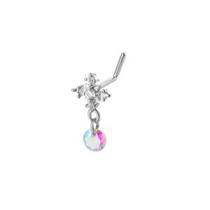Detailed view of L-shaped nose stud with zircon cross and iridescent charm