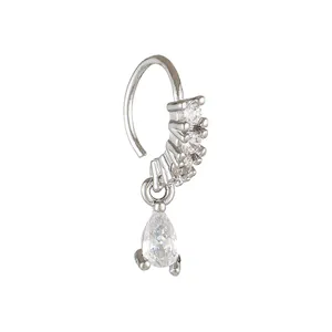 Detail of nose ring featuring triple round zircons and a dangling pear-shaped stone
