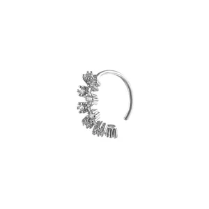 Macro detail of silver nose ring with claw-set cubic zirconia in a fan-shaped cluster