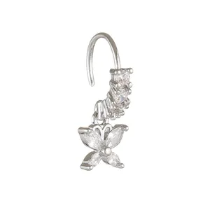 Detail of silver nose ring with shimmering butterfly pendant and cubic zirconia stones