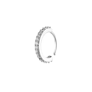 Macro shot of silver-toned nose ring with micro-pave cubic zirconia on white background